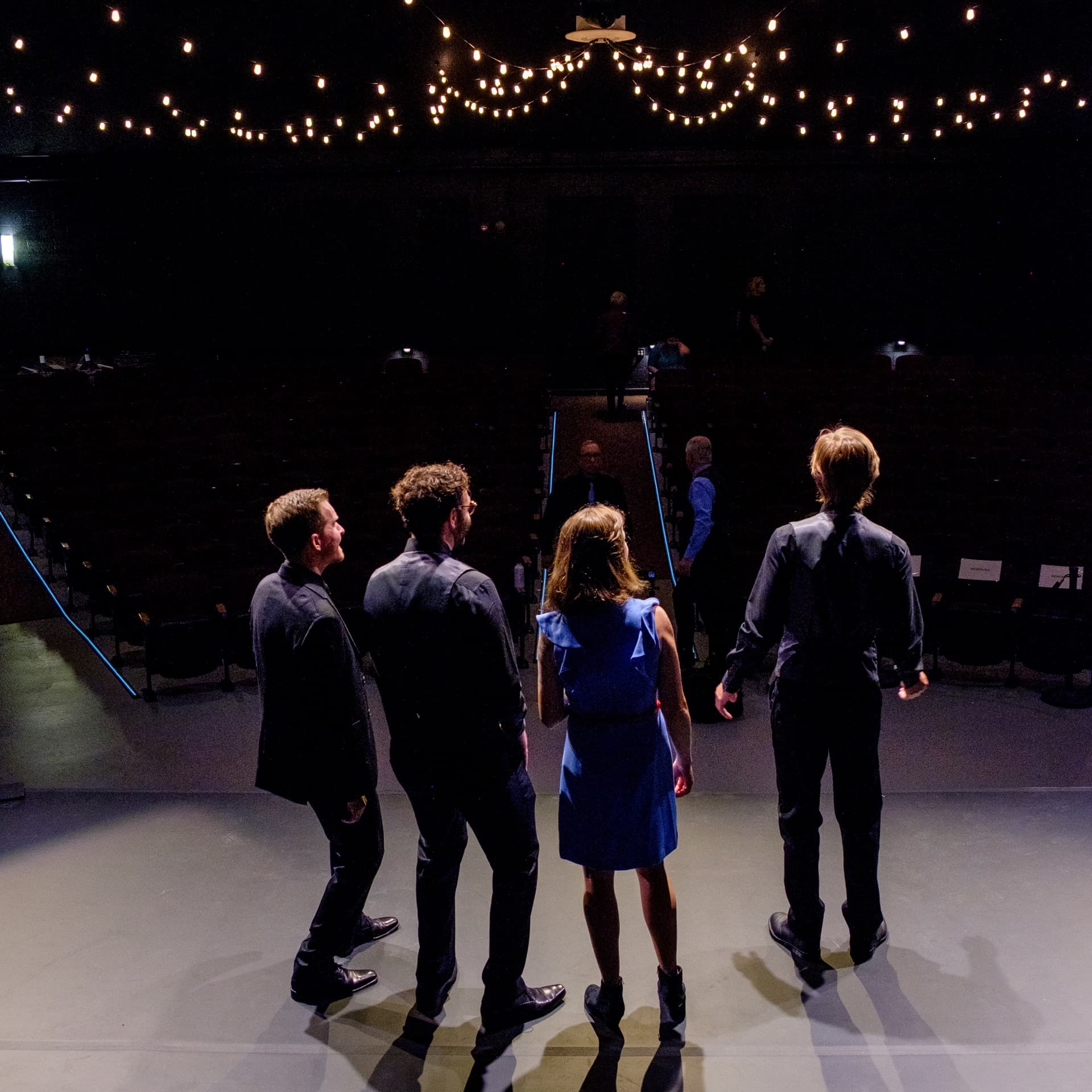 Constellation Quartet on stage with string lights